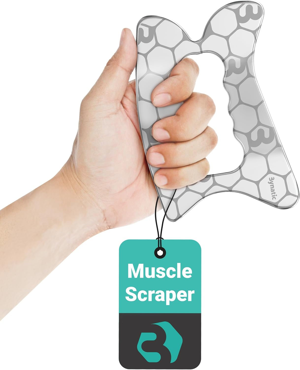 Bynatic Muscle Scraper held in one hand, showing its grip opening, four working edges and engraved surface pattern