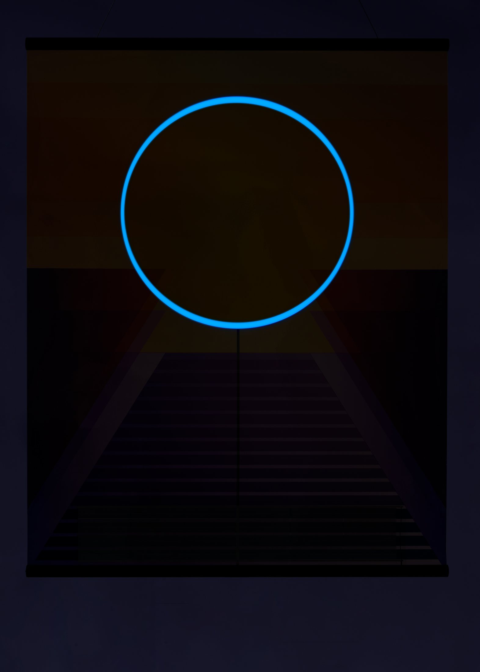 Close view of RA in darkness with a bright blue circular outline