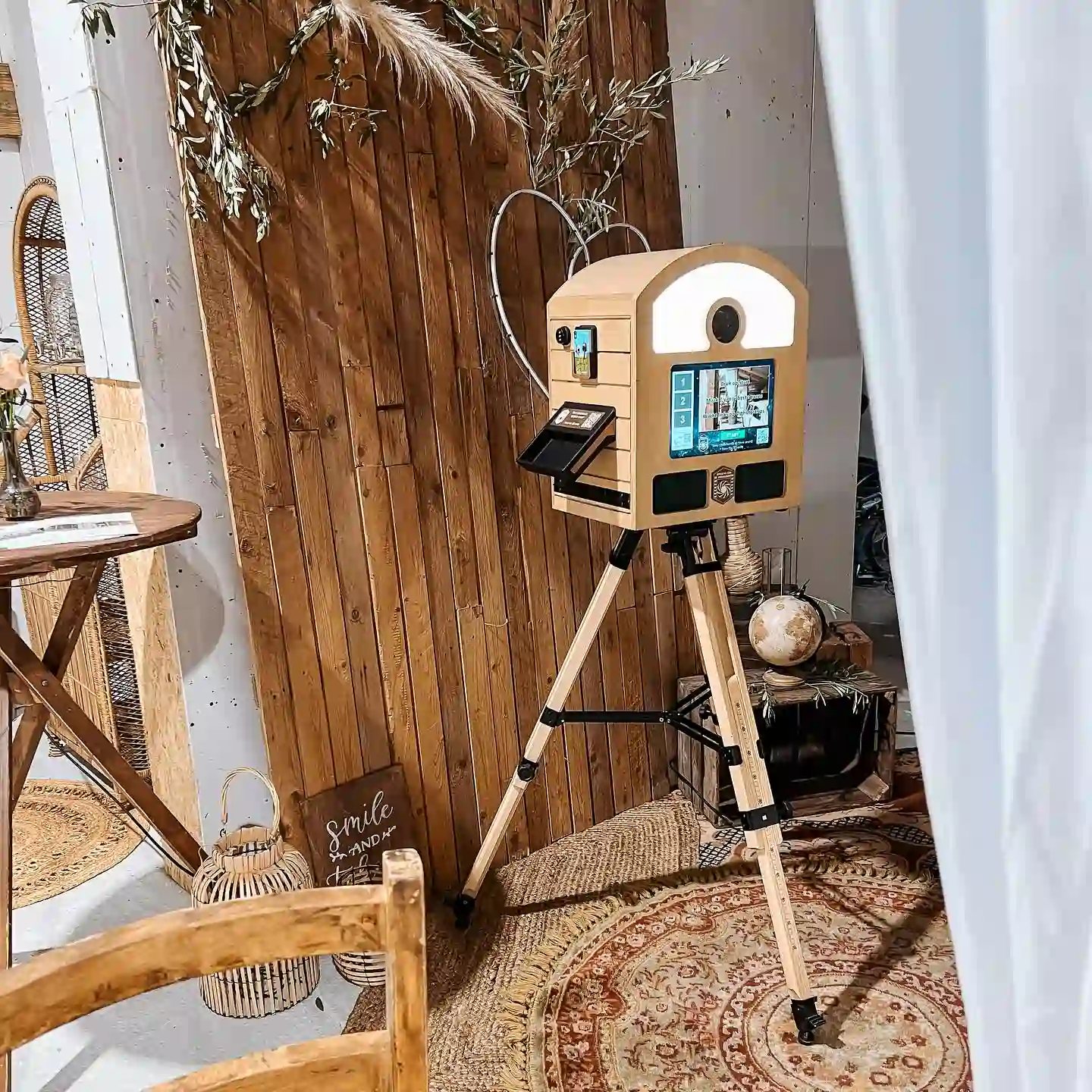 To Go Photobooth installed in a warm vintage wedding setting