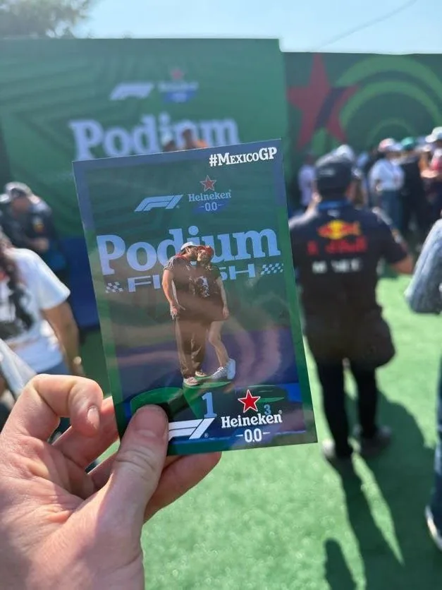 Printed Heineken podium photo held up in front of the live activation