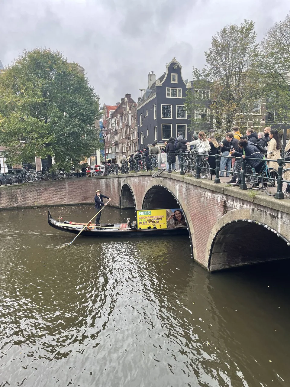 NET5 gondola and oversized campaign board passing the brick bridge