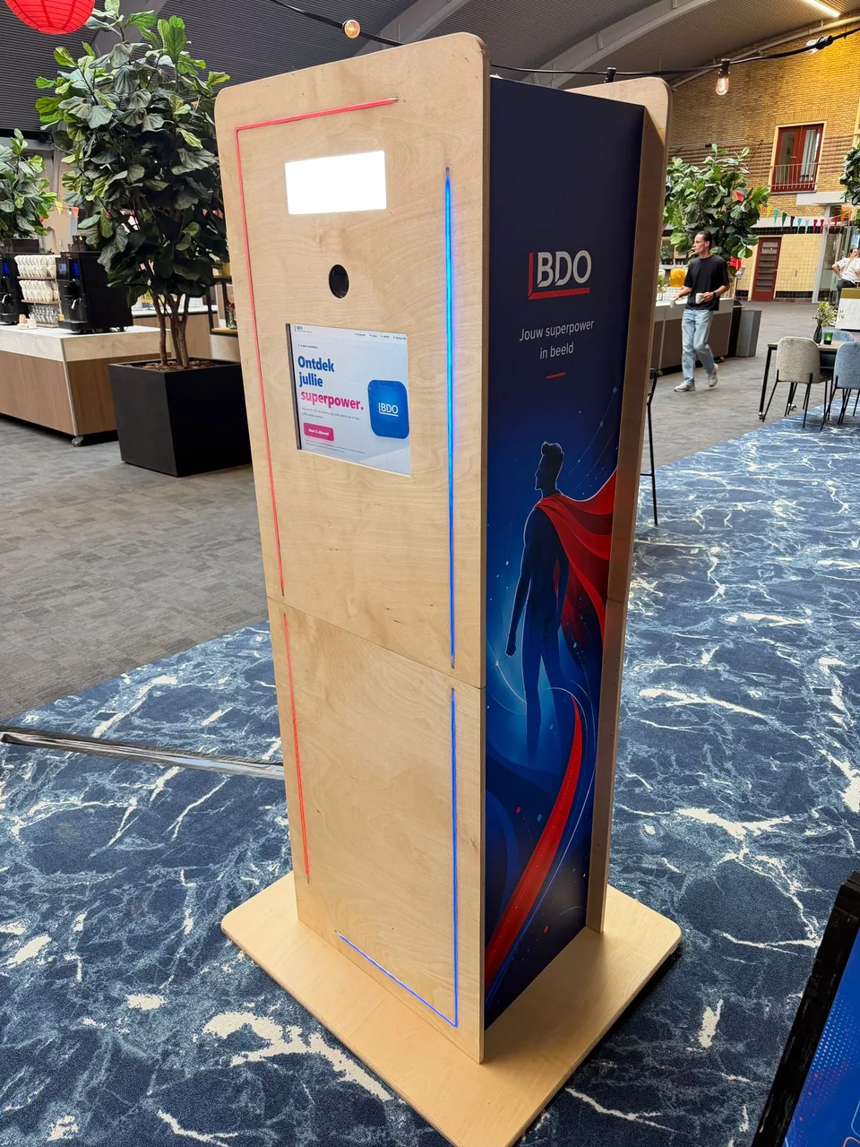 BDO Superpower Photobooth with a wooden housing, touchscreen and red and blue LED strips