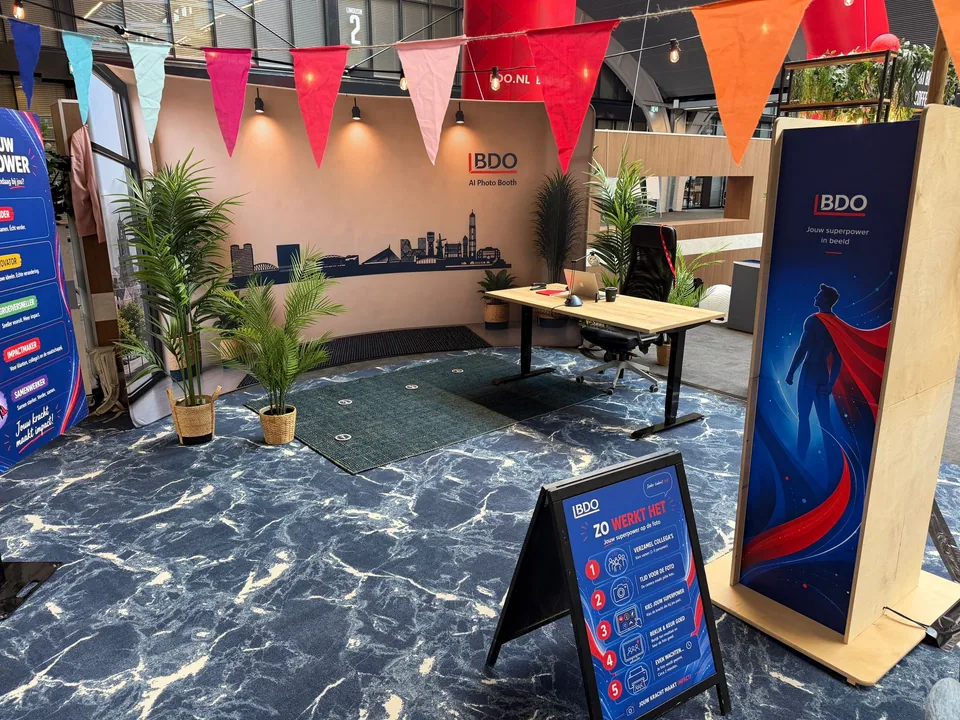 Superpower Photobooth in the BDO event area beside a photo backdrop and instructions