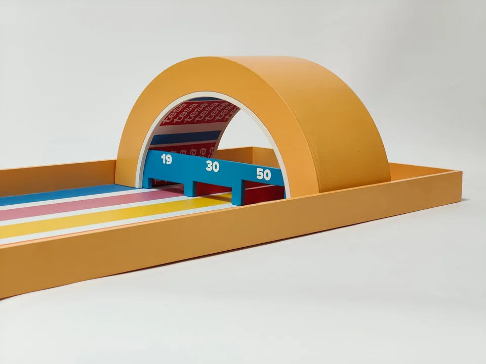 Close view of the curved scoring arch and numbered slots